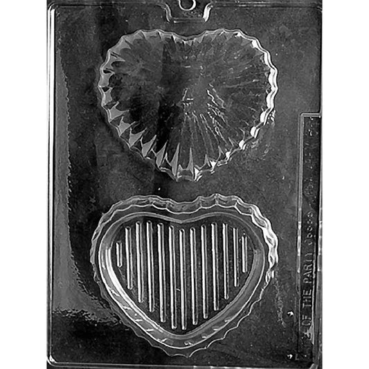 Clear Medium Heart Pour Box Chocolate Mold photographed against a black background with two heart-shaped cavities forming a faceted cut-glass-style lid and matching base.