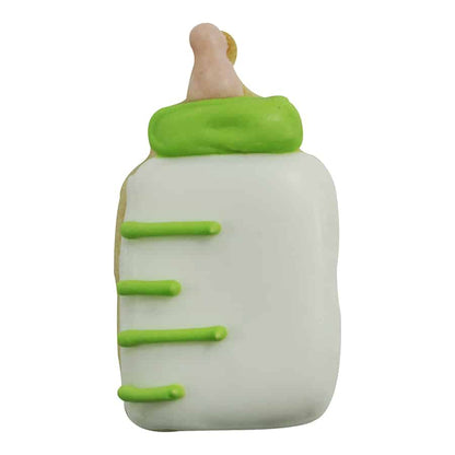 Decorated baby bottle-shaped cookie with white icing, green accents, and a bottle nipple detail.