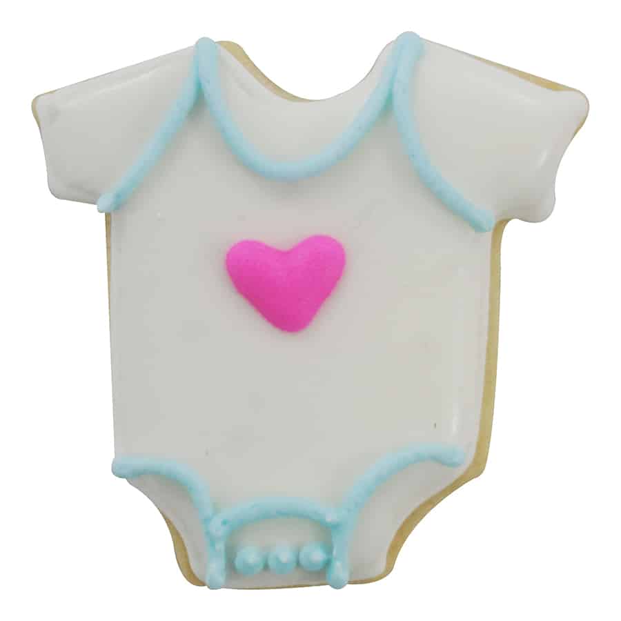 Decorated baby bodysuit-shaped cookie with white icing, blue trim, and a pink heart in the center.