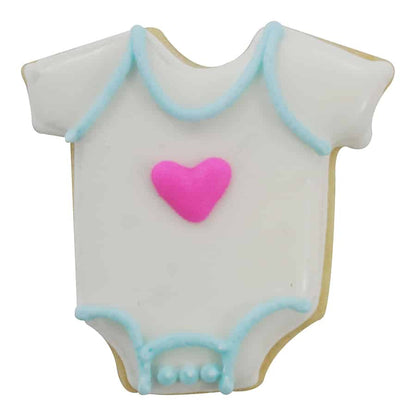 Decorated baby bodysuit-shaped cookie with white icing, blue trim, and a pink heart in the center.