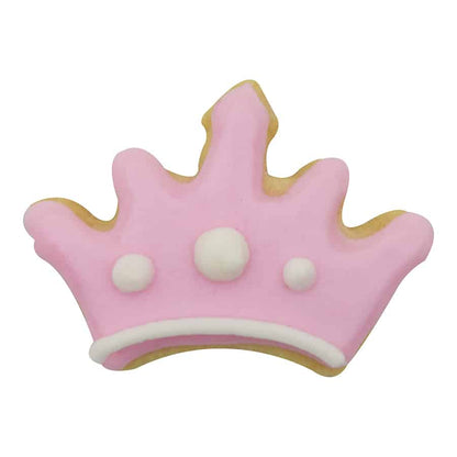 Decorated crown-shaped cookie with pink icing, white trim, and small pearl-like details, made using the Mini Crown Cookie Cutter.