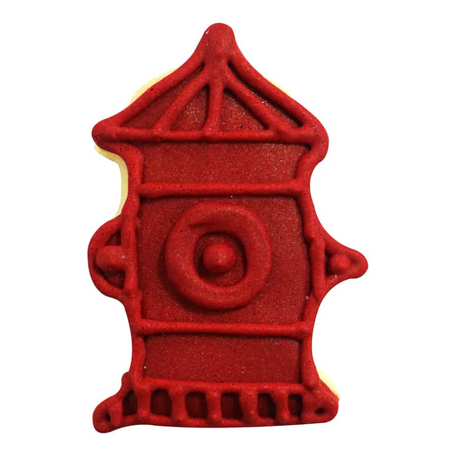 A decorated fire hydrant cookie with vibrant red icing, featuring sculpted details.