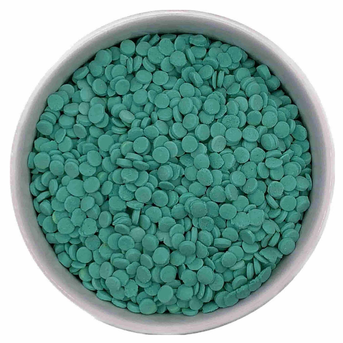 Close-up of flat round mint green and teal Confetti Quinn Sprinkles in a white bowl, sold in a 4 oz. package