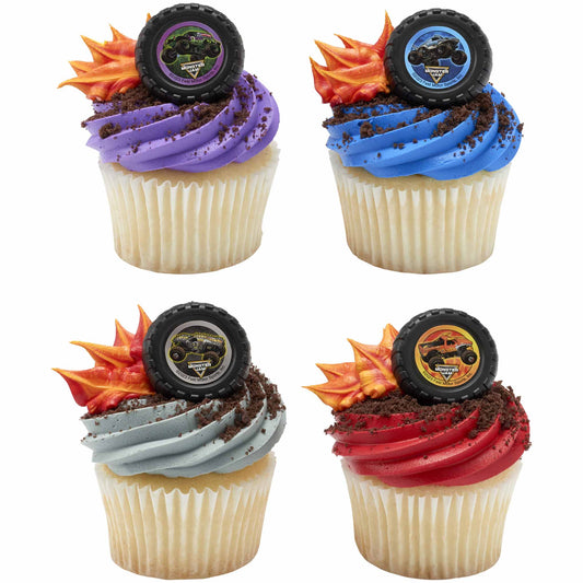 Four cupcakes decorated with colorful frosting, chocolate crumb dirt, orange flames, and tire-shaped Monster Jam monster truck topper rings