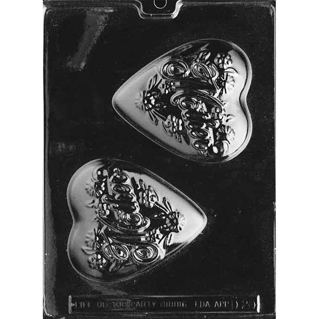 Clear plastic chocolate mold with two deep heart-shaped cavities, each featuring raised “Mother” in flowing script with small floral patterns around the lettering; shown on a dark background.