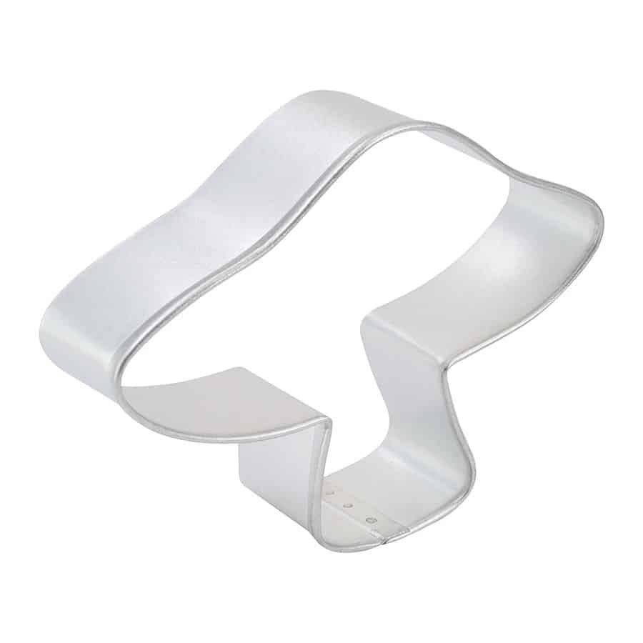 Side view of a mushroom cookie cutter with a curved cap and sturdy base.