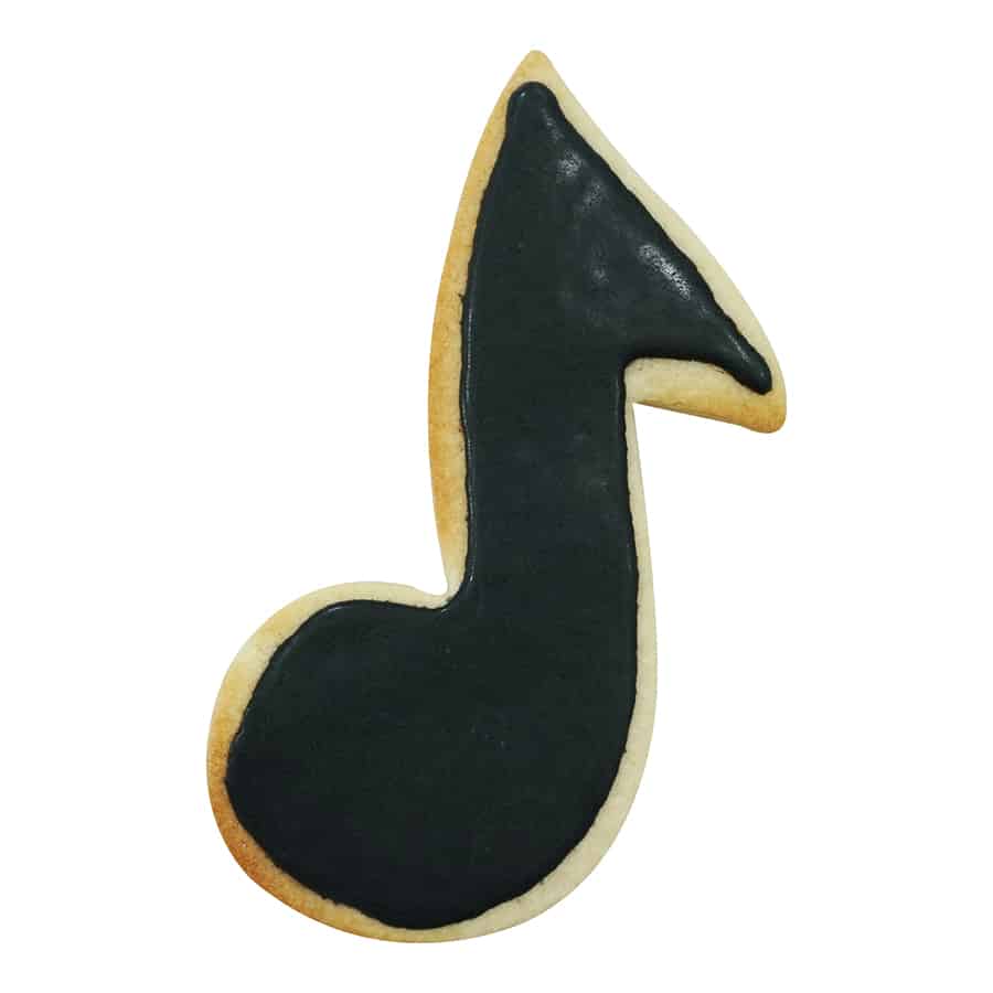 Decorated music note cookie with black icing on a golden-brown base.