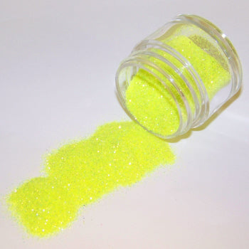 Neon citrus yellow Galaxy Glitter Dust poured from a jar, glowing vibrantly with an intense, citrusy sparkle.