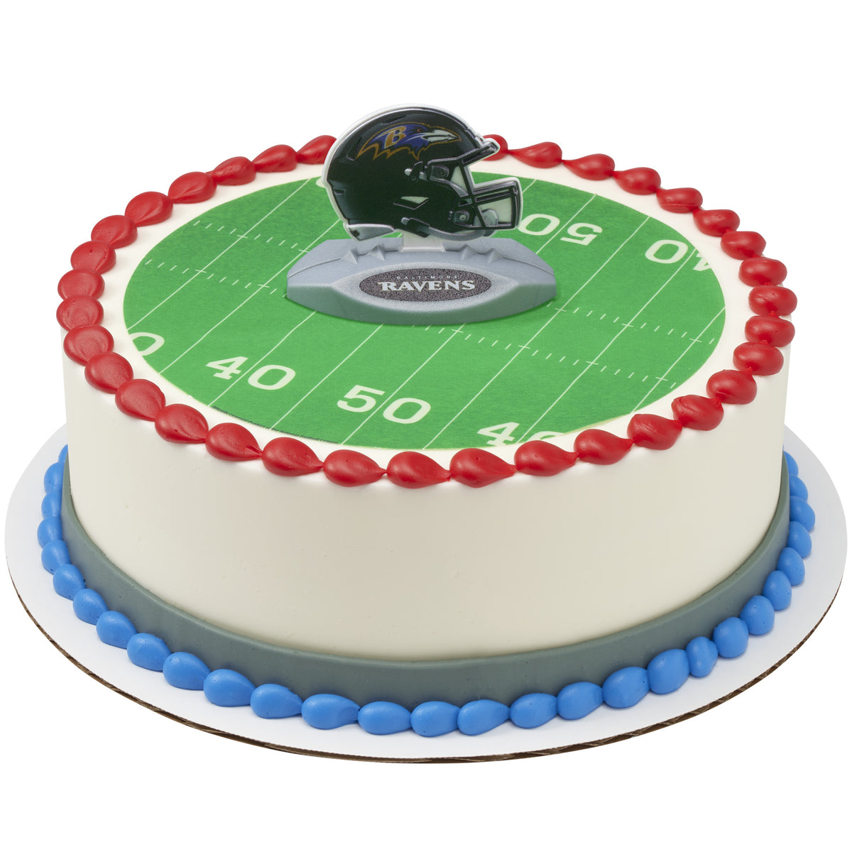 A round cake decorated with a green football field print, red piped border, blue and gray base accents, and a Baltimore Ravens helmet topper on top.