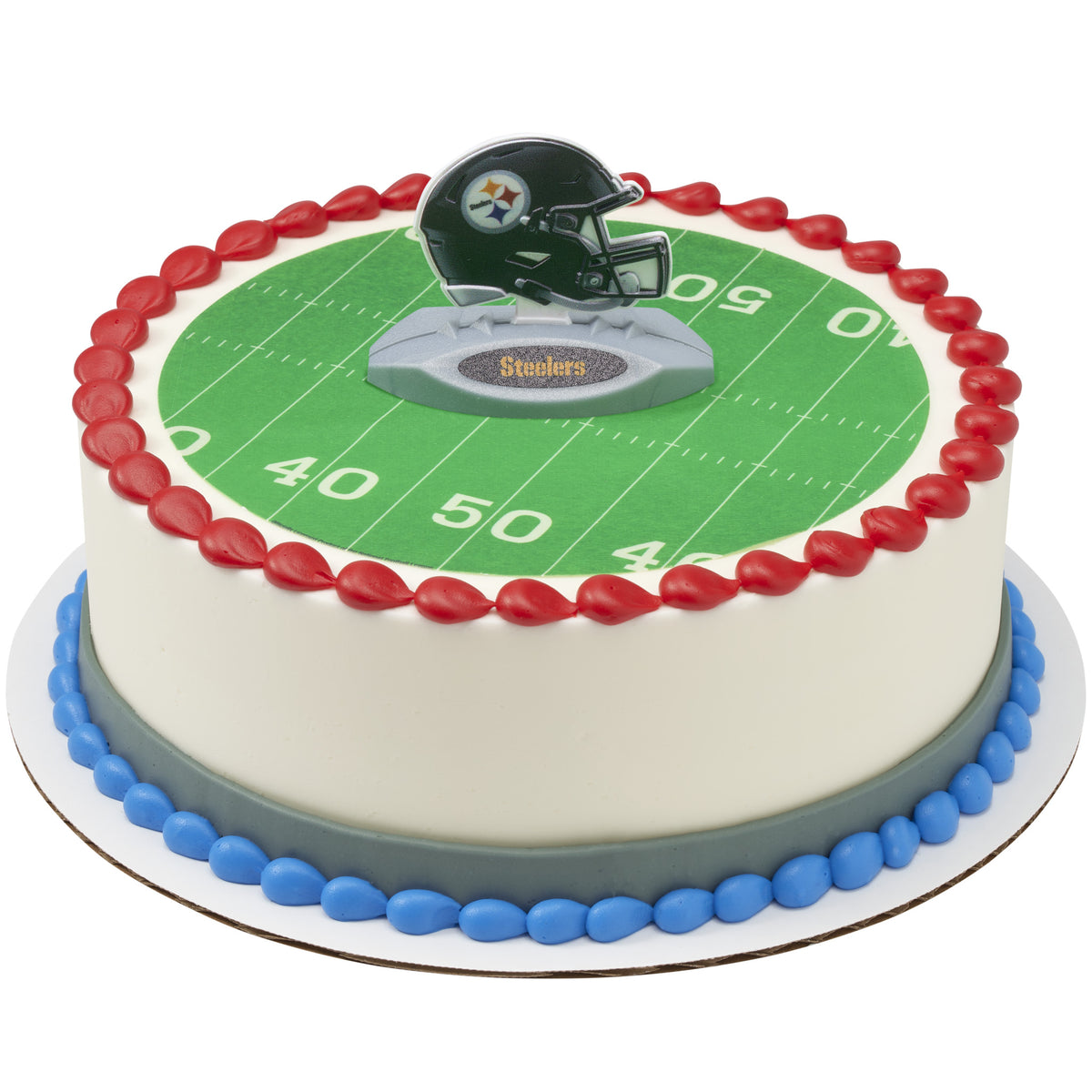 A round cake decorated with a Pittsburgh Steelers football theme, featuring a green yard line design, red and blue piped borders, and a helmet topper on top.