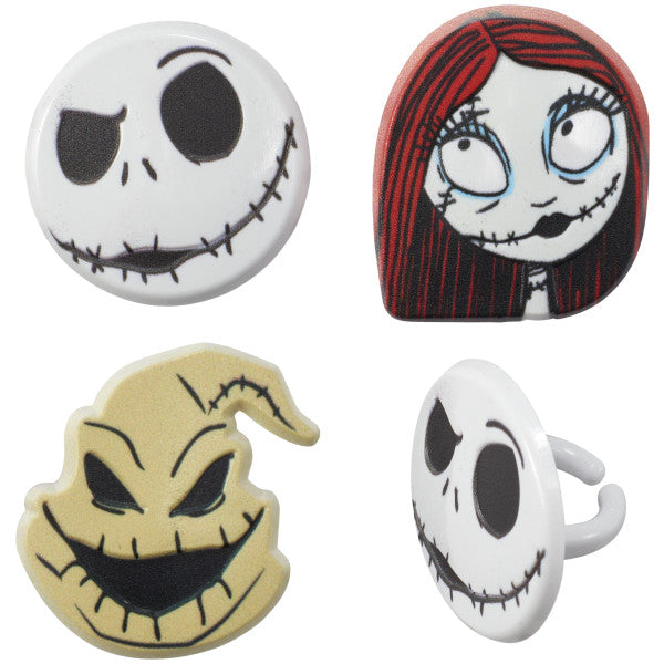 Close-up of four Nightmare Before Christmas cupcake rings, including two Jack Skellington faces, Sally, and Oogie Boogie.