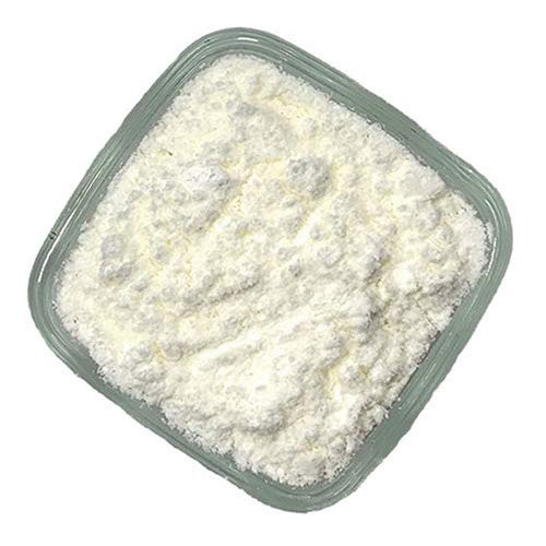 Square plastic container filled with white non-melting snow sugar powder, shown from above.