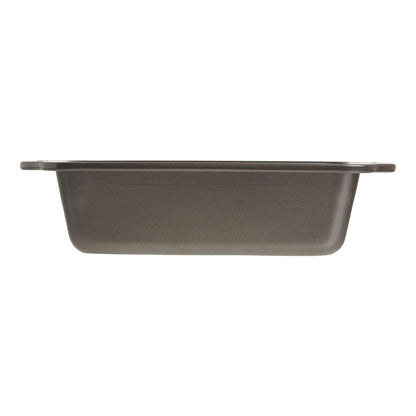 Side view of a 9 x 5-inch nonstick loaf pan showing its 2 3/4-inch depth and wide rim