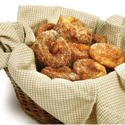 Basket of golden-brown popovers coated in cinnamon sugar, lined with a checkered cloth.