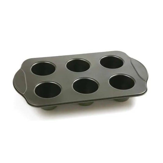 Empty nonstick popover pan with six evenly spaced cavities, perfect for baking tall pastries.