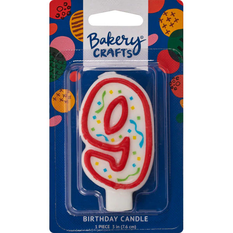 Packaged number 9 birthday candle with a white center, red outline, and multicolor confetti sprinkles on a blue Bakery Crafts card.