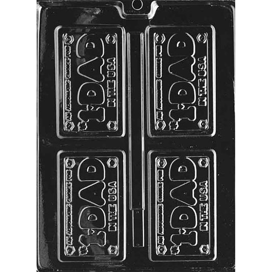 Clear plastic chocolate mold with four license plate–style cavities reading “#1 Dad in the USA,” featuring raised lettering and small bolt details in each corner.