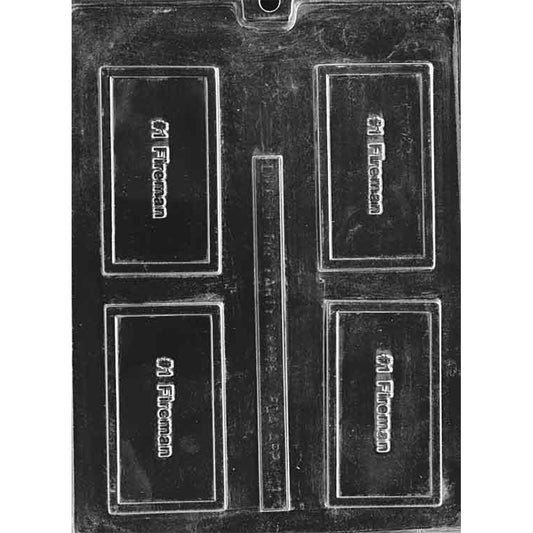 Clear plastic chocolate bar mold photographed on a black background with four rectangular cavities, each embossed with “#1 Fireman” lettering inside a raised border.