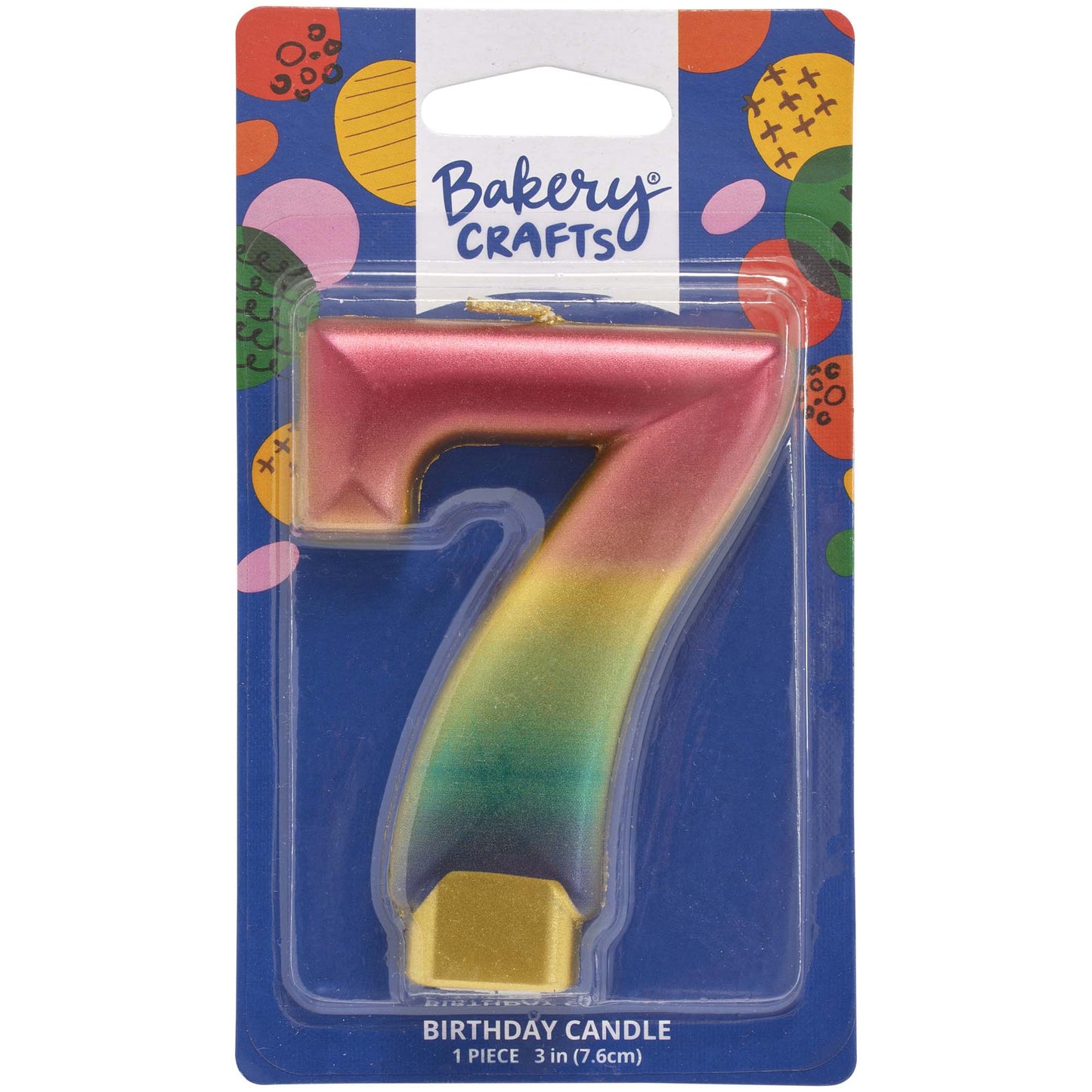 Packaged metallic rainbow number 7 birthday candle with a pink-to-gold-to-green-to-blue gradient and a gold base, on a blue Bakery Crafts card.