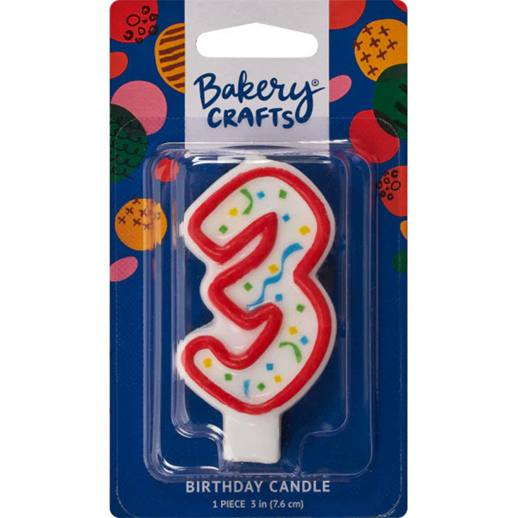 Packaged number 3 birthday candle with a white center, red outline, and multicolor confetti sprinkles on a blue Bakery Crafts card.