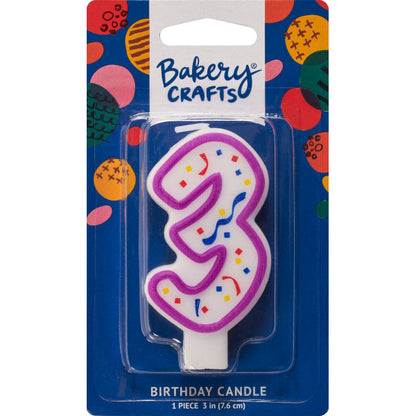 Packaged number 3 birthday candle with a purple outline and colorful confetti center on a blue Bakery Crafts backing card with multicolor dots.