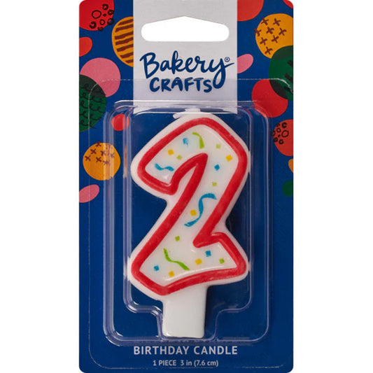 Packaged number 2 birthday candle with a white center, red outline, and multicolor confetti sprinkles on a blue Bakery Crafts card.