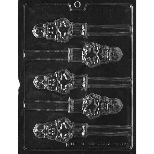 Clear plastic chocolate mold with six nutcracker soldier topper cavities designed to sit on pretzel rods, featuring a toy soldier holding a star with raised uniform details.
