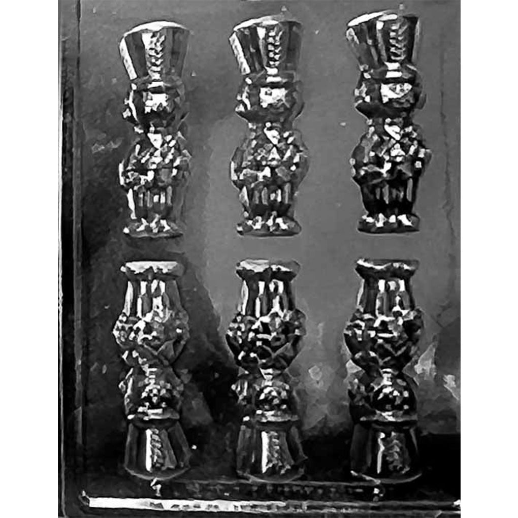 Clear plastic Toy Soldier Chocolate Mold shown against a black background with six nutcracker-style soldier cavities.