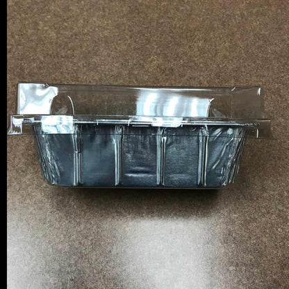 Side view of an aluminum loaf pan with a clear plastic lid.