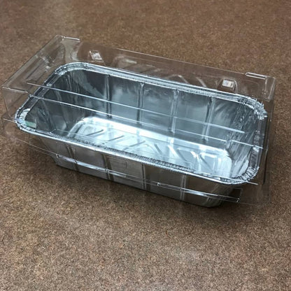 Aluminum loaf pan with a clear plastic lid.