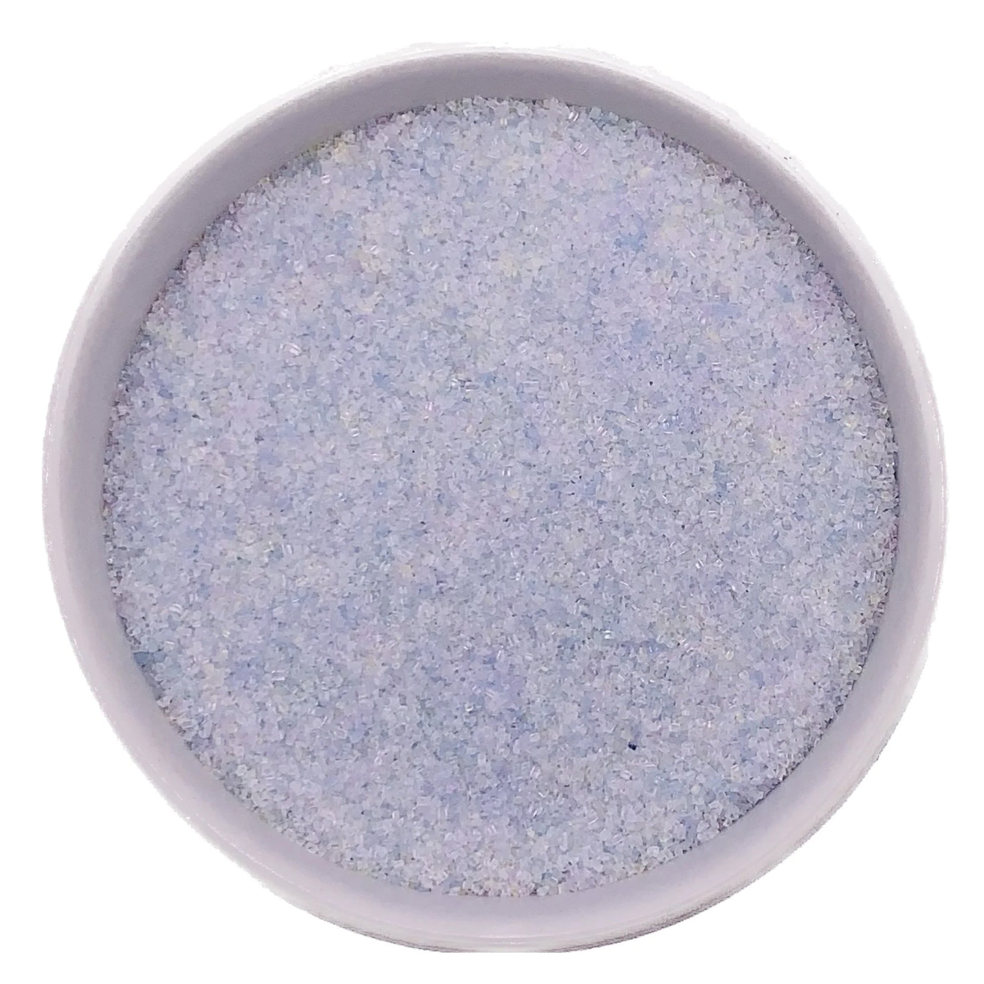 Top-down view of a white bowl filled with opal fine sanding sugar, showing very pale iridescent crystals with a soft pearly shimmer.