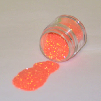 Neon orange Galaxy Glitter Dust glowing from within, spilled from a jar with a high-energy, fiery sparkle.