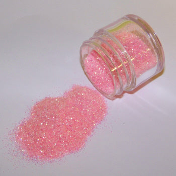 Soft pastel pink Galaxy Glitter Dust spilled from a jar, sparkling delicately with opalescent highlights and a fairy-like glow.