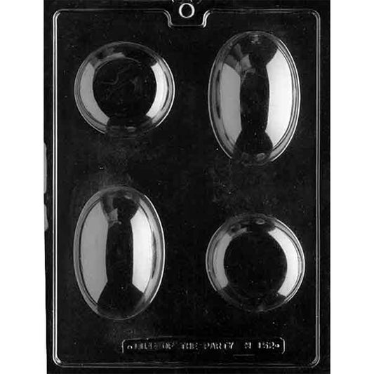 Clear plastic chocolate mold photographed on a black background with four smooth cavities, including two oval shapes and two round shapes arranged in a grid.