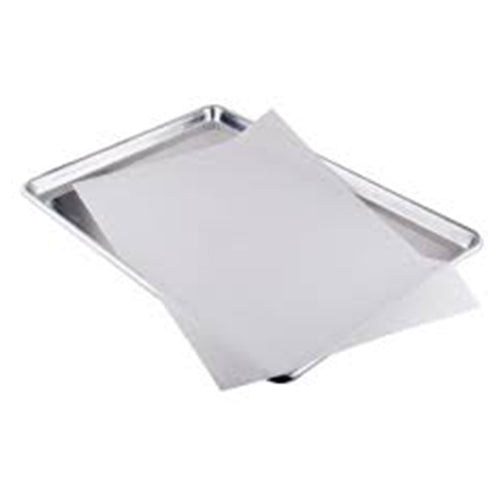 White half sheet parchment paper placed on a silver half sheet baking pan, showing a pre-cut liner sized to fit the pan.
