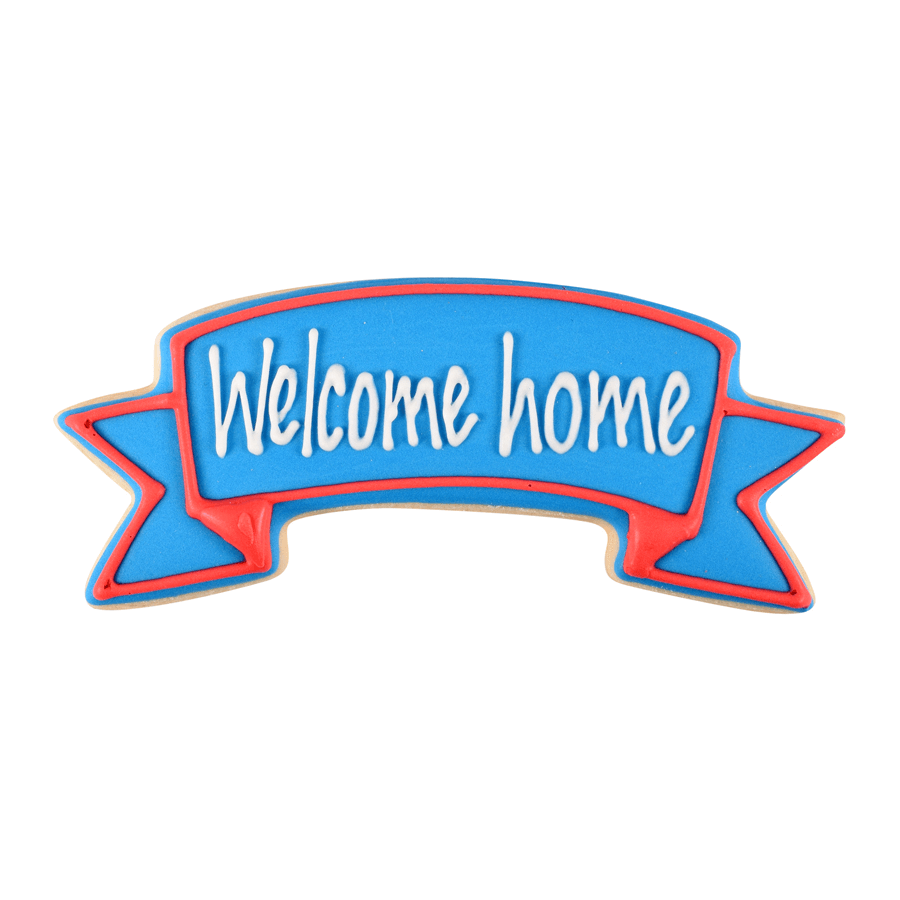 Decorated cookie in the shape of a banner with blue icing and a red border, featuring the message "Welcome Home" in white lettering.