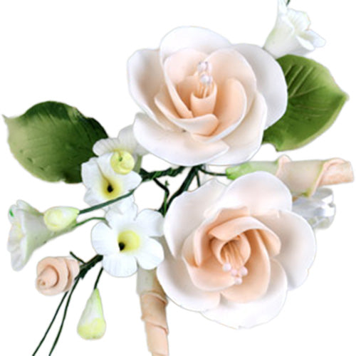 Peach dog rose gum paste flower spray with two cream-and-peach rose blooms, white filler flowers, green leaves, and buds on wired stems.