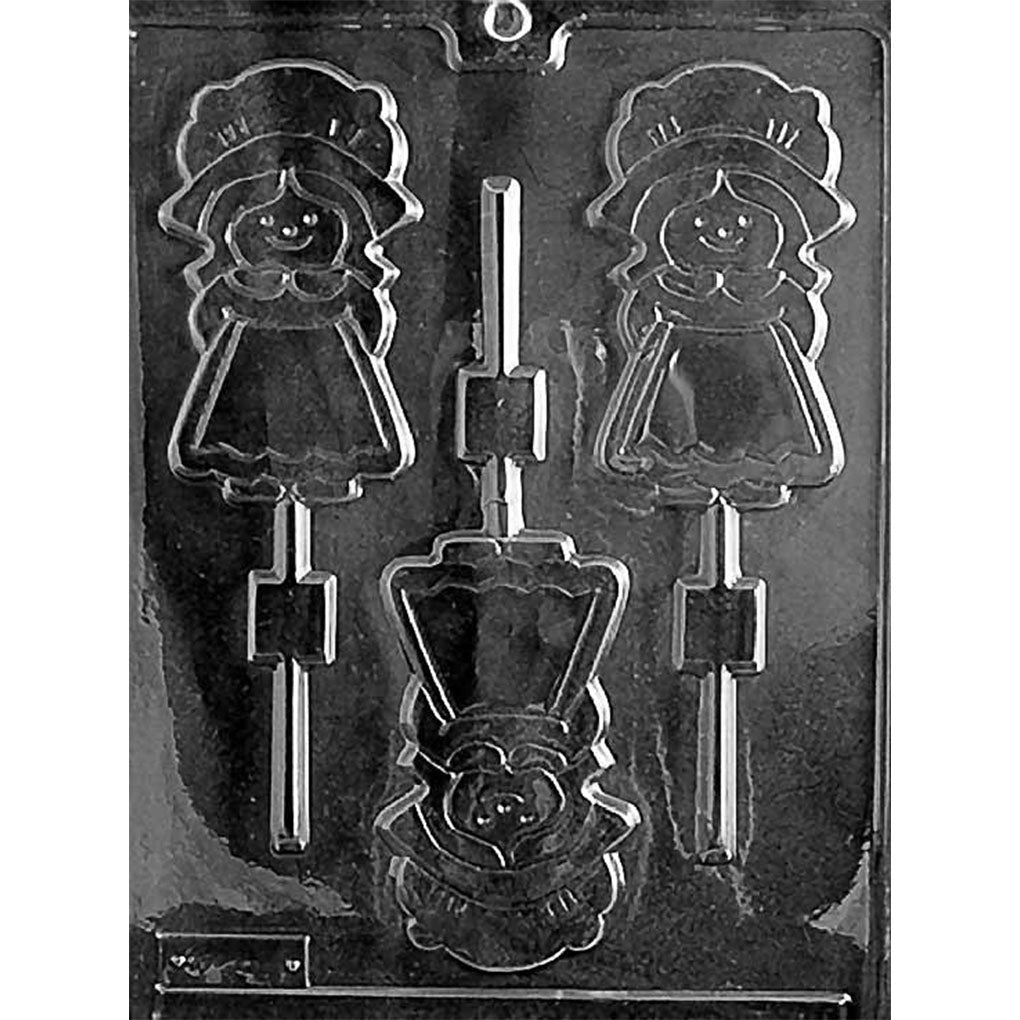 Clear plastic chocolate lollipop mold with three girl pilgrim cavities featuring bonnets, dresses, outlined details, and stick channels