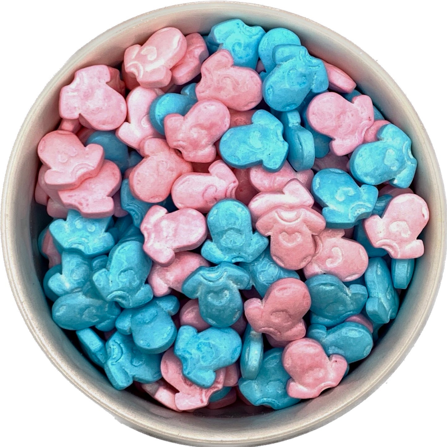 Top-down view of a round container filled with pastel baby onesie sprinkles in pink and bright blue, showing glossy, chunky shapes on a white background.