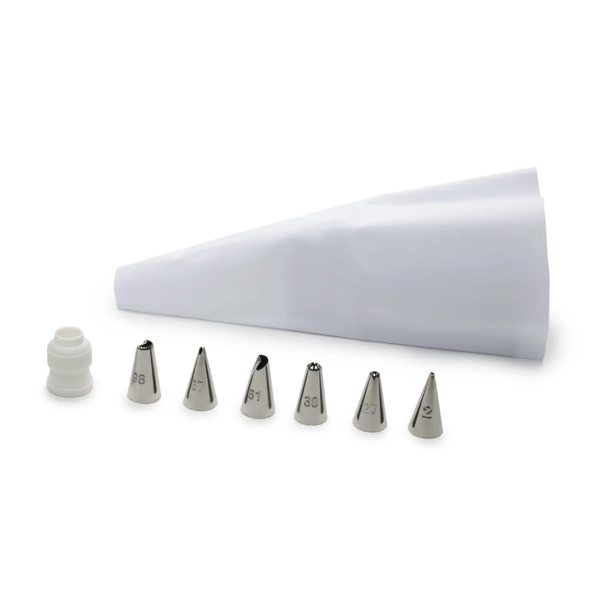 White reusable piping bag with six stainless steel icing tips labeled 98, 67, 61, 30, 27, and 2, a plastic coupler, all arranged on a white background