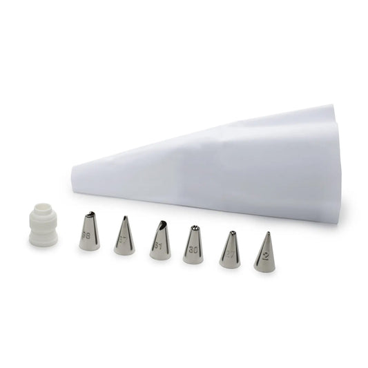 White reusable piping bag with six stainless steel icing tips labeled 98, 67, 61, 30, 27, and 2, a plastic coupler, all arranged on a white background