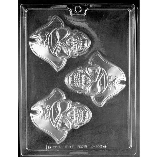 Clear Pirate Skull Chocolate Mold photographed against a black background with 3 large pirate skull cavities featuring eye patches, head wraps, pirate hats, and skull-and-crossbones accents.