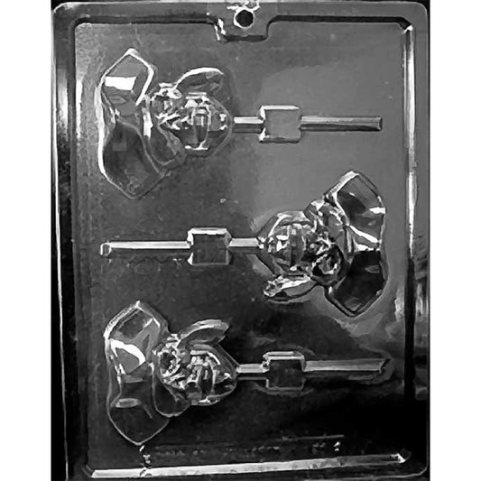 Pirate skull chocolate lollipop mold with skulls wearing pirate hats and molded channels for lollipop sticks