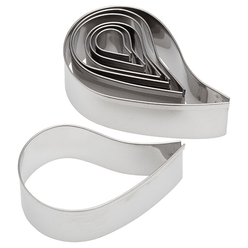 Set of seven stainless steel comma-shaped cookie cutters nested together, showing various sizes.