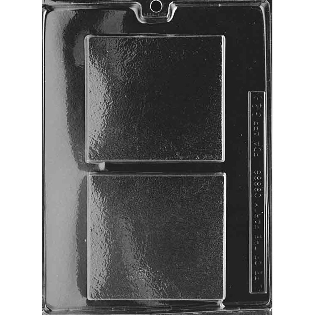 Clear plastic chocolate mold with two large plain square bar cavities featuring undecorated surfaces and slightly rounded corners.