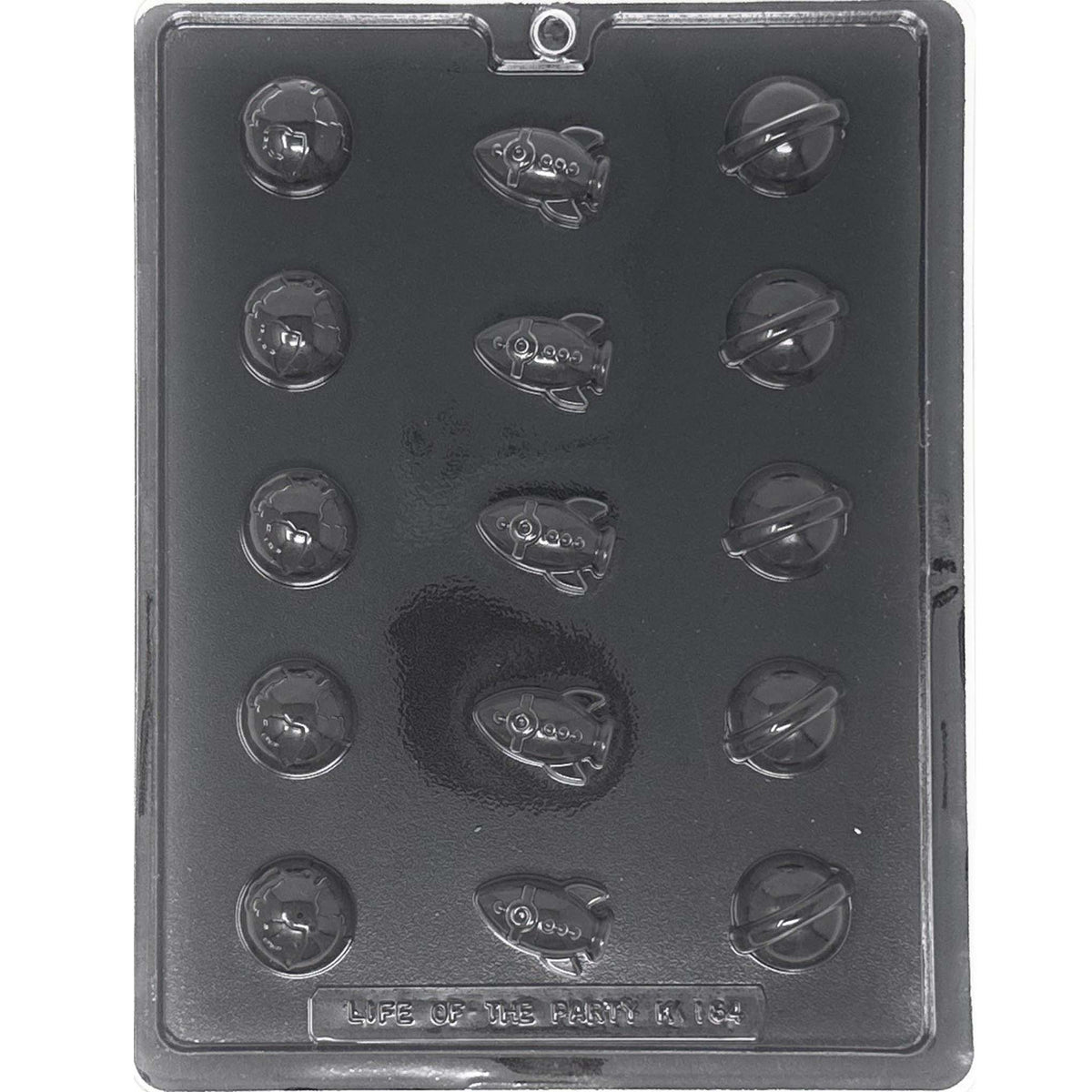 Clear Bite Size Planets & Spaceships Chocolate Mold photographed against a black background with 15 cavities featuring Earths, rocket ships, and ringed planets.