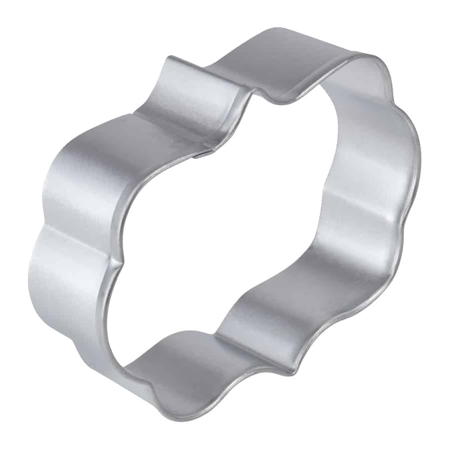 Angled side view of a sturdy plaque-shaped cookie cutter with reinforced edges.