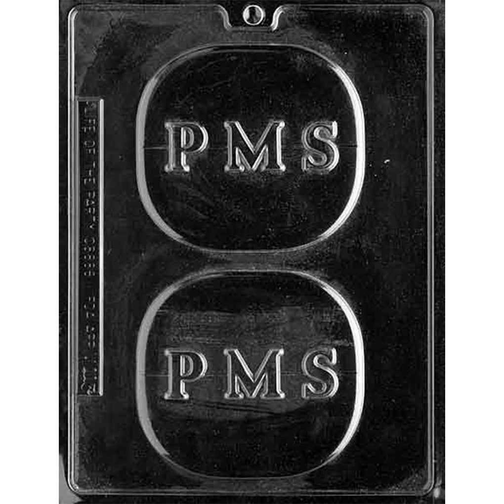 Clear plastic chocolate mold with two large pill-shaped cavities, each embossed with the letters “PMS” inside a rounded capsule outline.