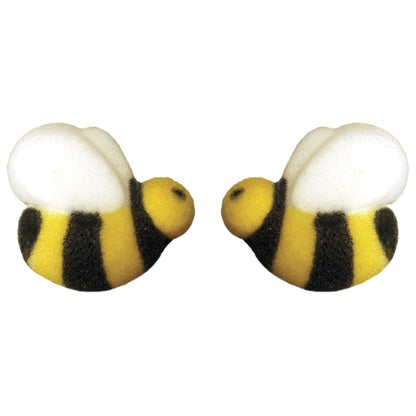 Pressed sugar decorations shaped like bumble bees with black and yellow stripes and white wings