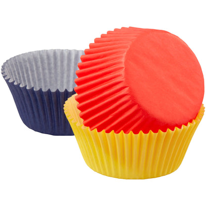 Red, yellow, and navy blue baking cups stacked together on a white background